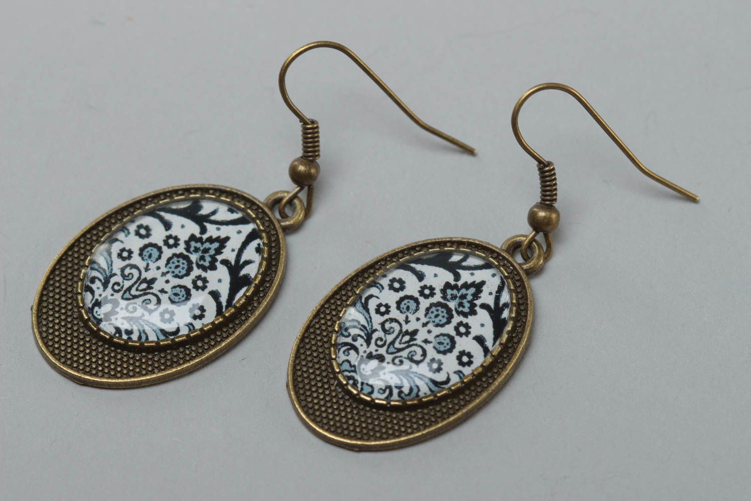 Handmade vintage metal earrings of oval shape with patterns coated with glaze photo 2