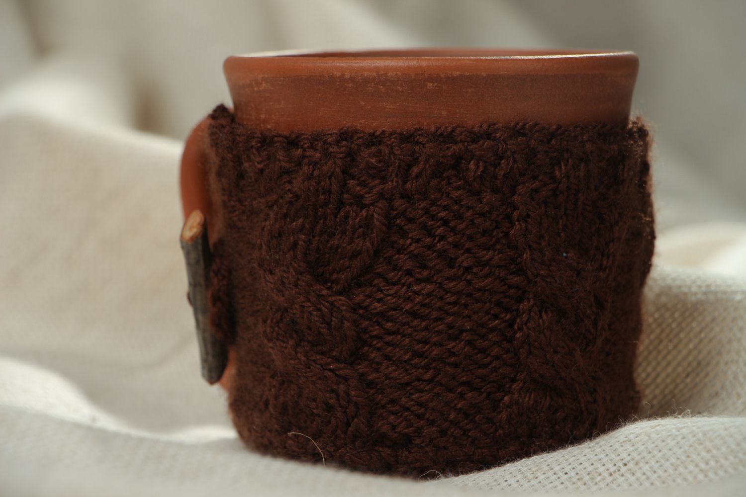 Ceramic cup in terracotta color with knitted back cozy cover photo 5