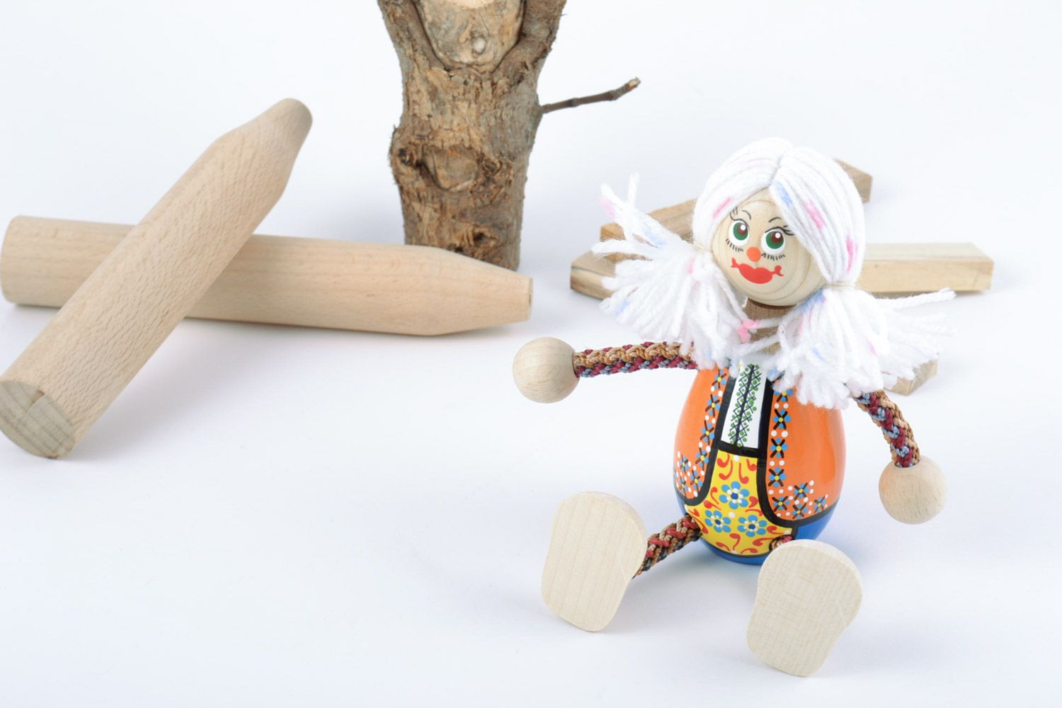 Handmade painted wooden eco toy funny girl in Ukrainian costume with white hair photo 1