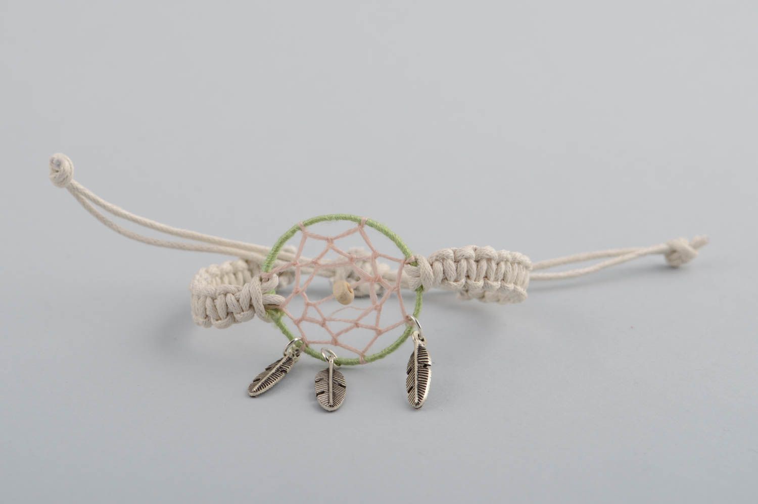 Handmade light macrame woven cord wrist bracelet with dreamcatcher and charms photo 3
