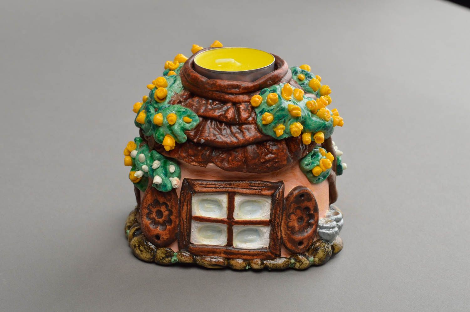 Schöner ethnischer origineller handgemachter Kerzenhalter aus Polymerton foto 4