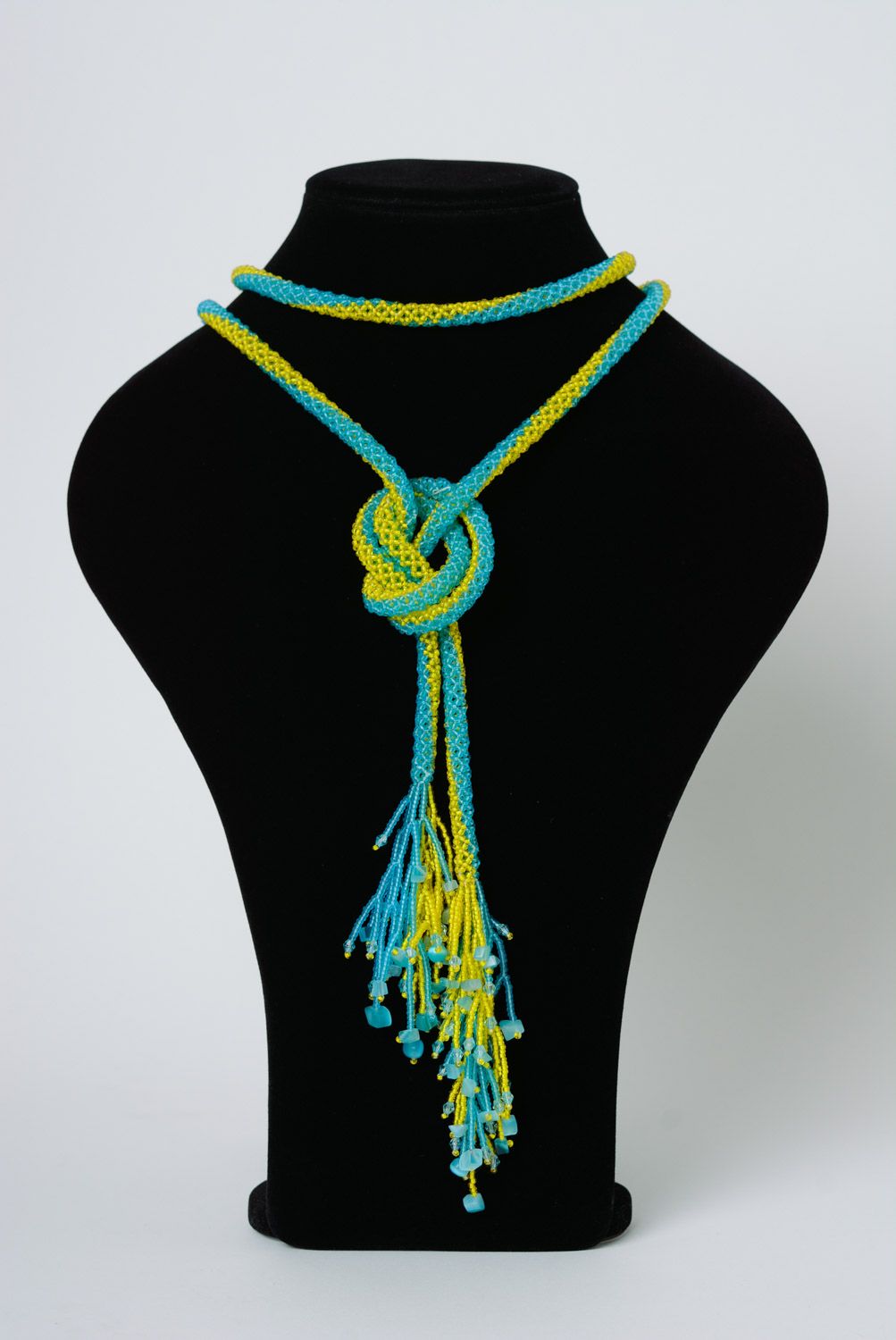 Beautiful long handmade necklace woven of beads of yellow and blue colors photo 2