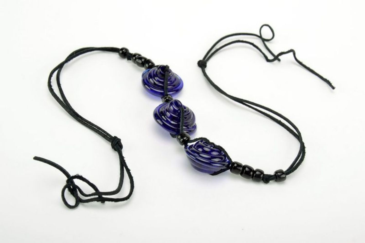 Dark blue tough glass necklace with leather cord photo 3