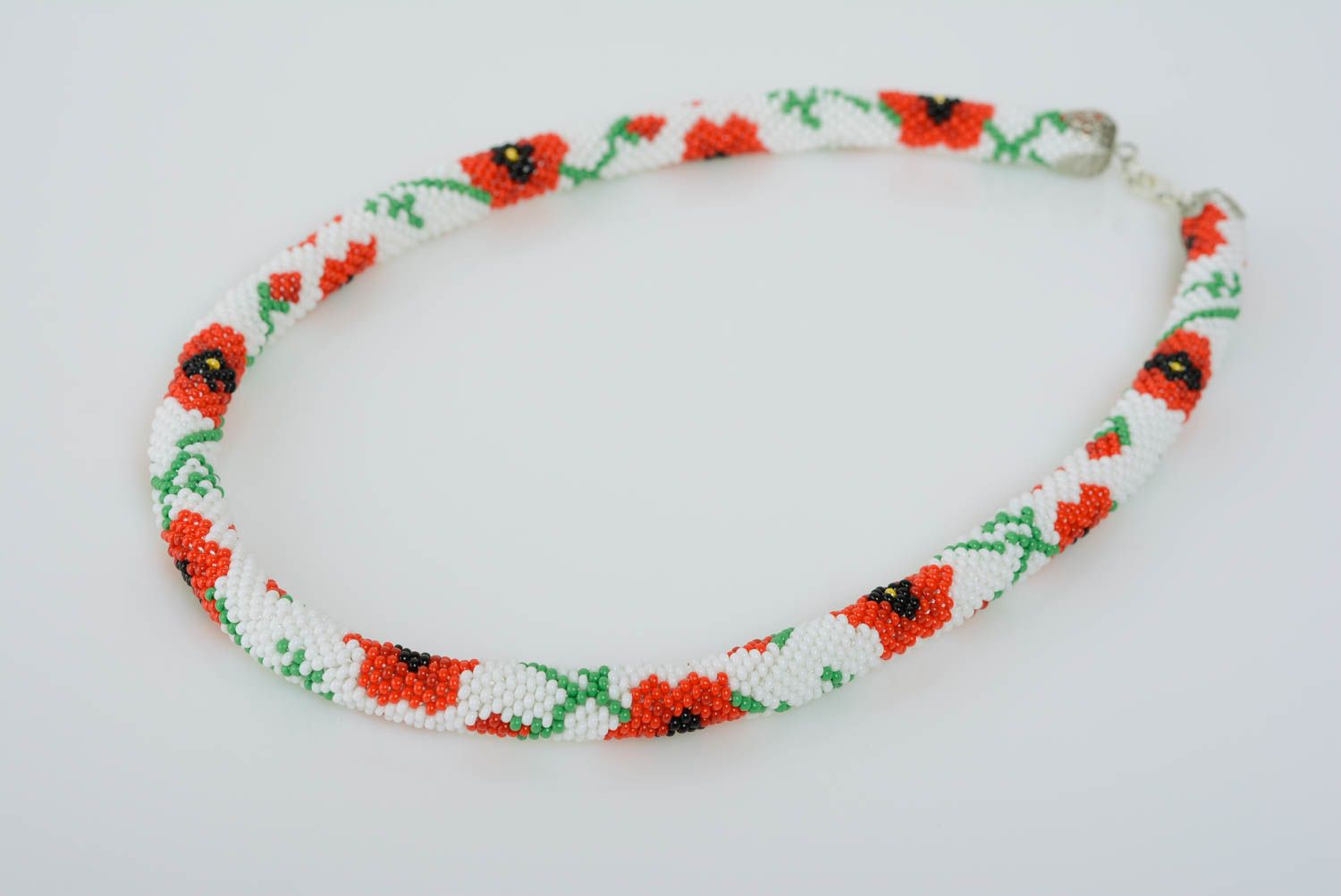 Beaded handmade cord necklace with flowers red poppies on white background photo 1