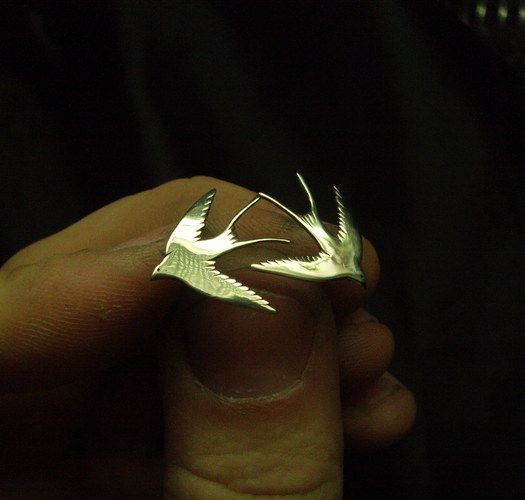 Metal earrings in the shape of birds photo 1