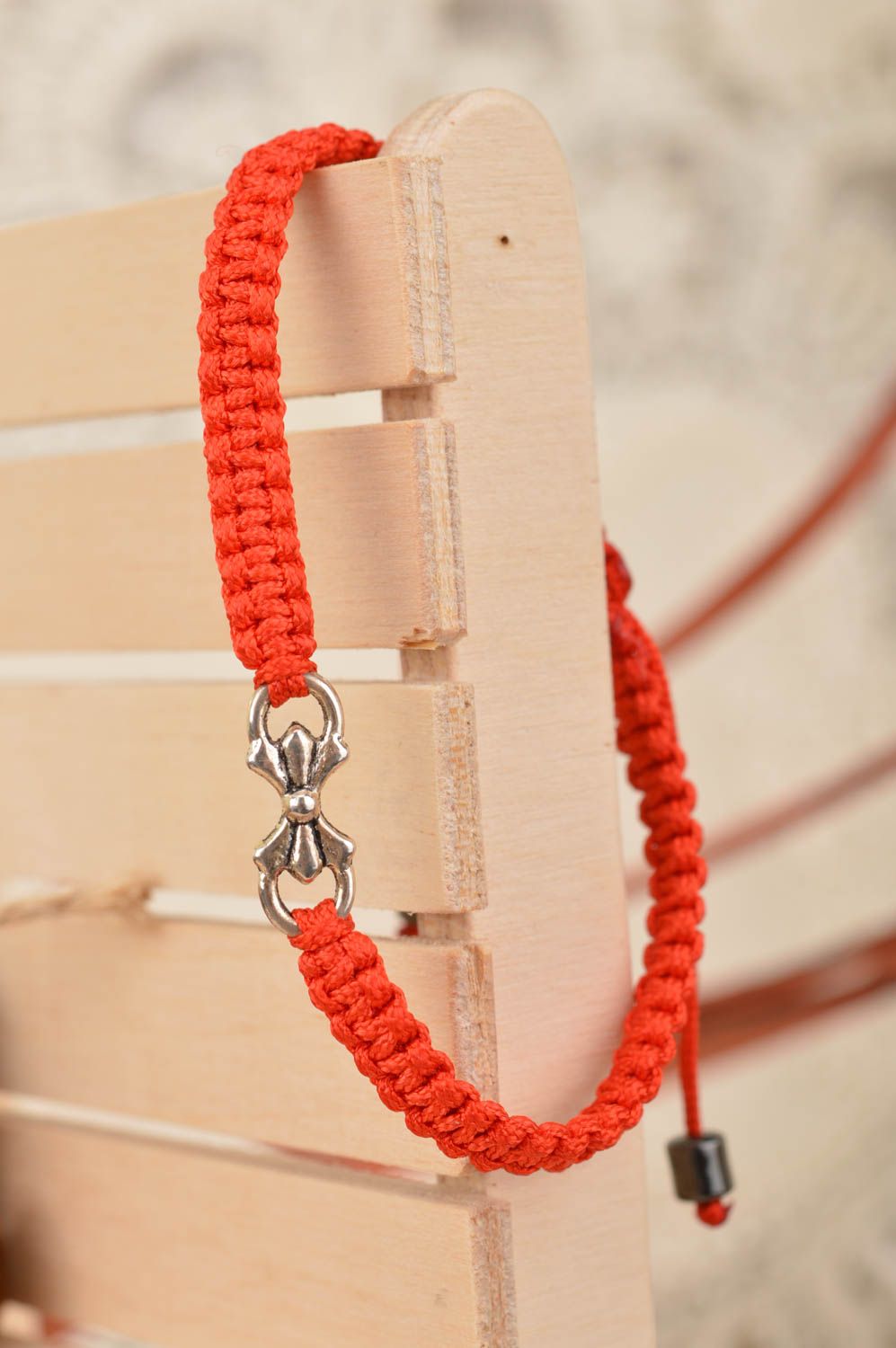 Handmade woven thin unusual red bracelet made of silk threads with bow photo 1