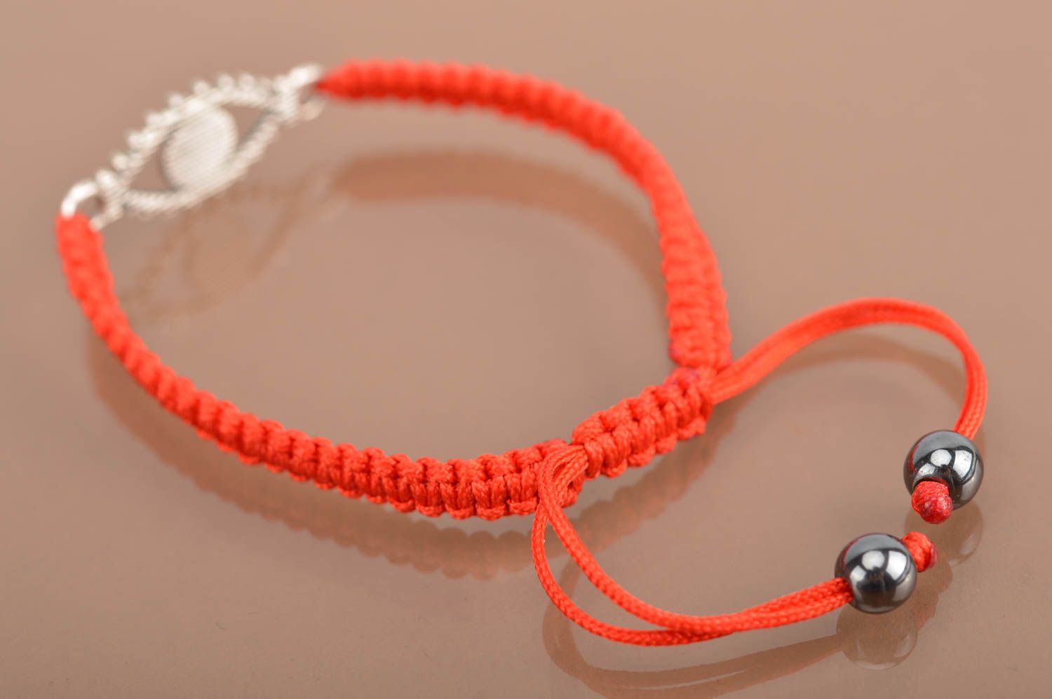 Handmade red bracelet made of silk threads with insert in shape of eye photo 5