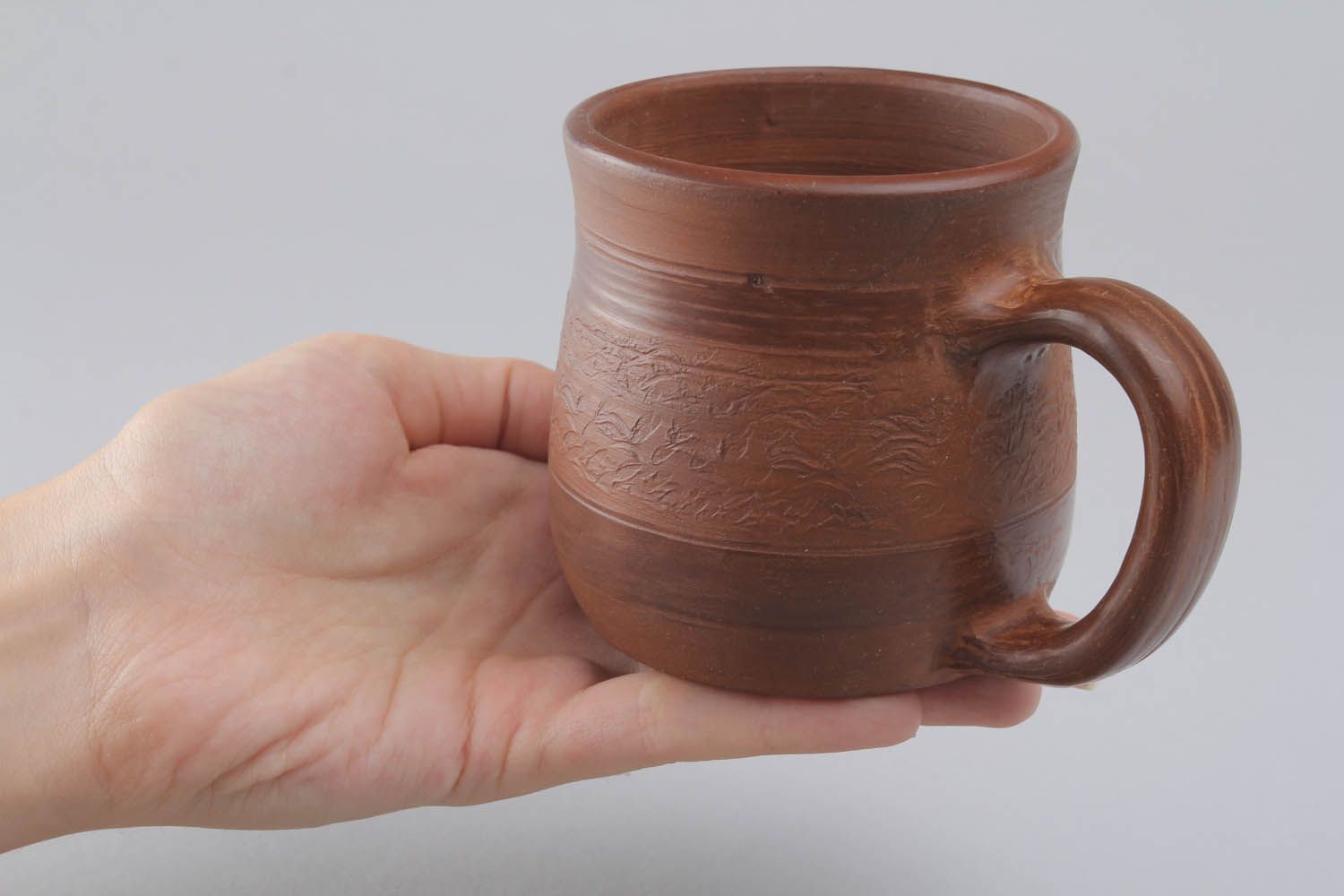 Brown clay coffee mug with handle and no pattern in the rustic shape photo 5