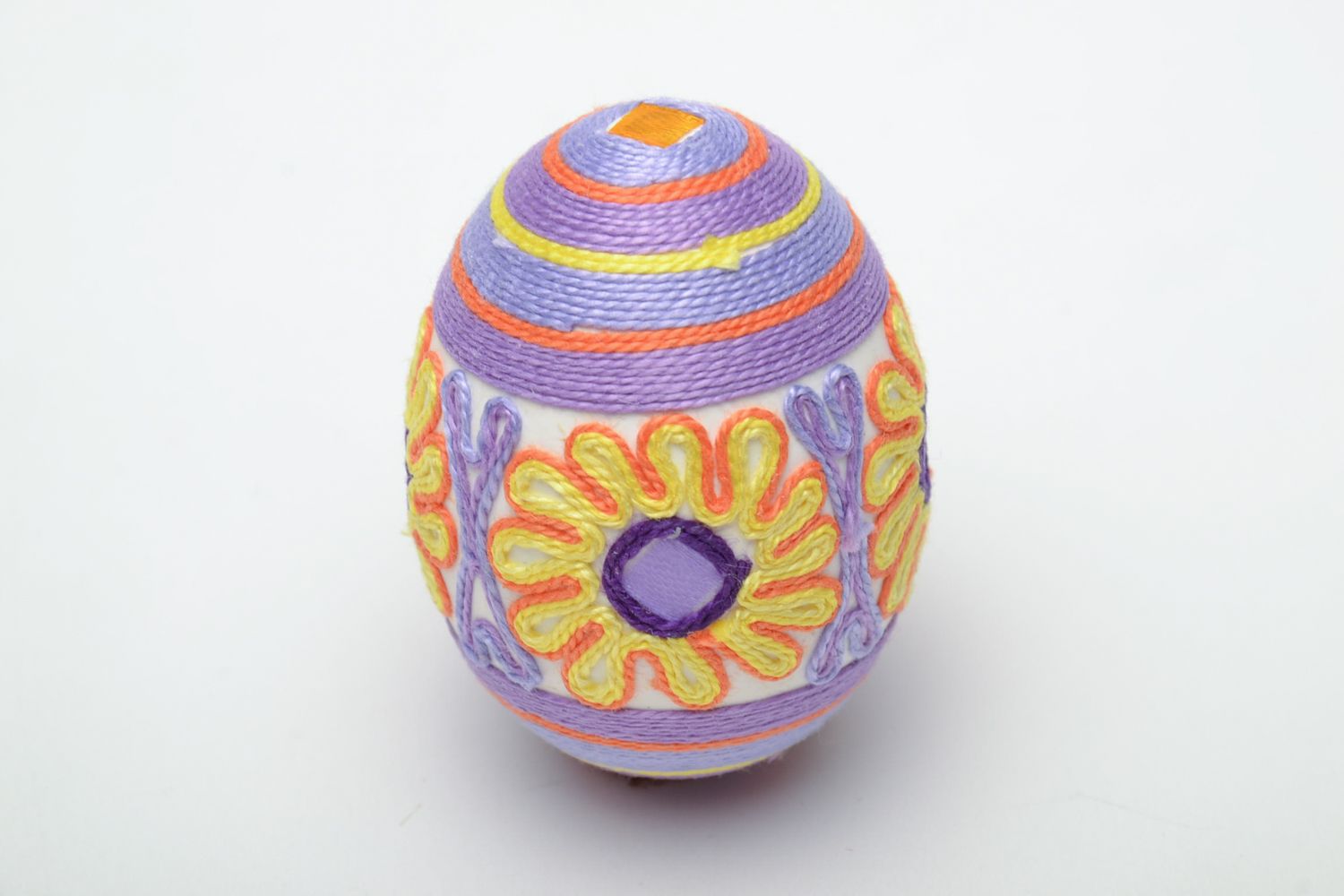 Easter egg woven over with threads photo 2