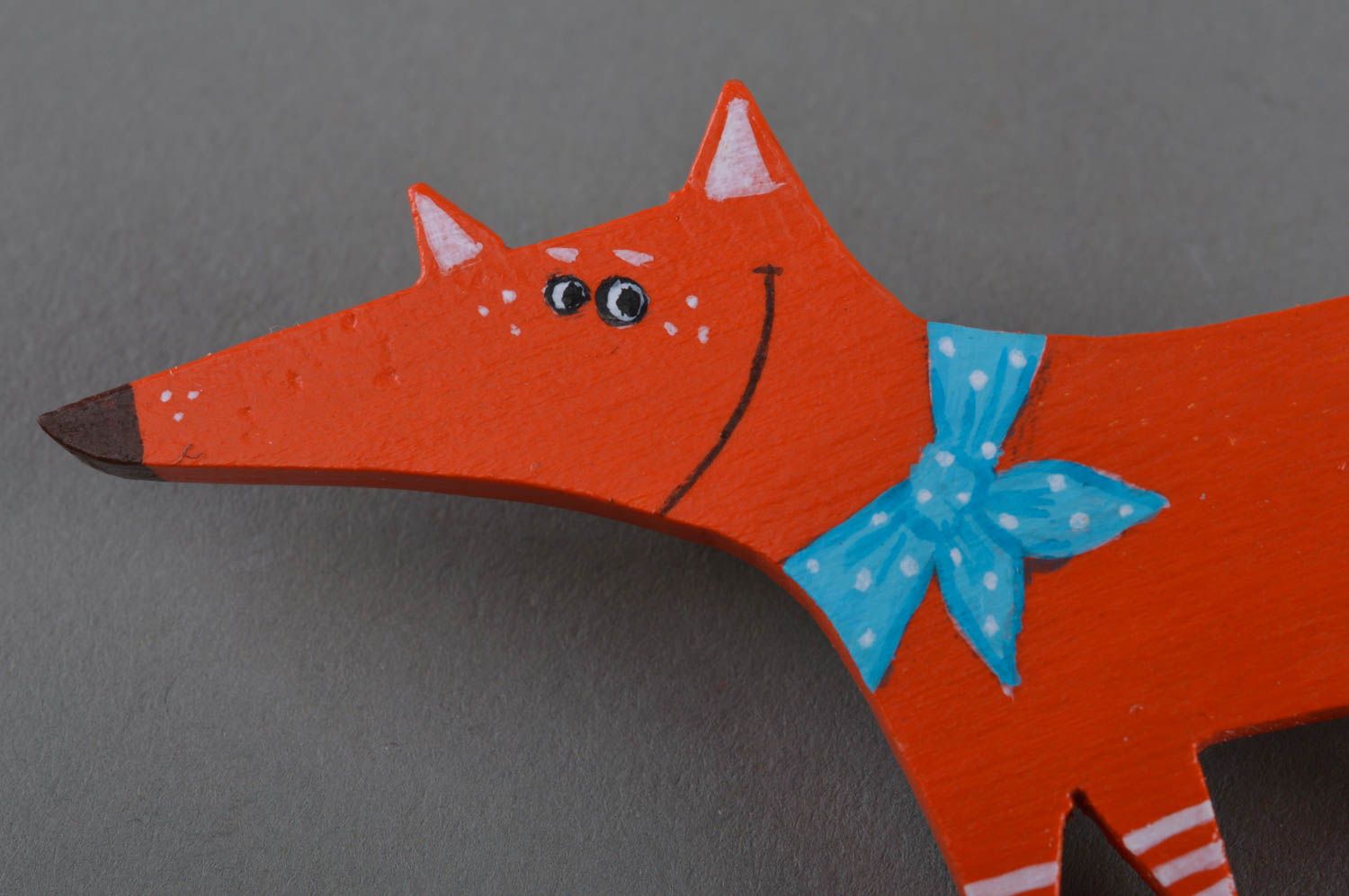 Handmade small painted wooden brooch in the shape of red fox with blue bow photo 2