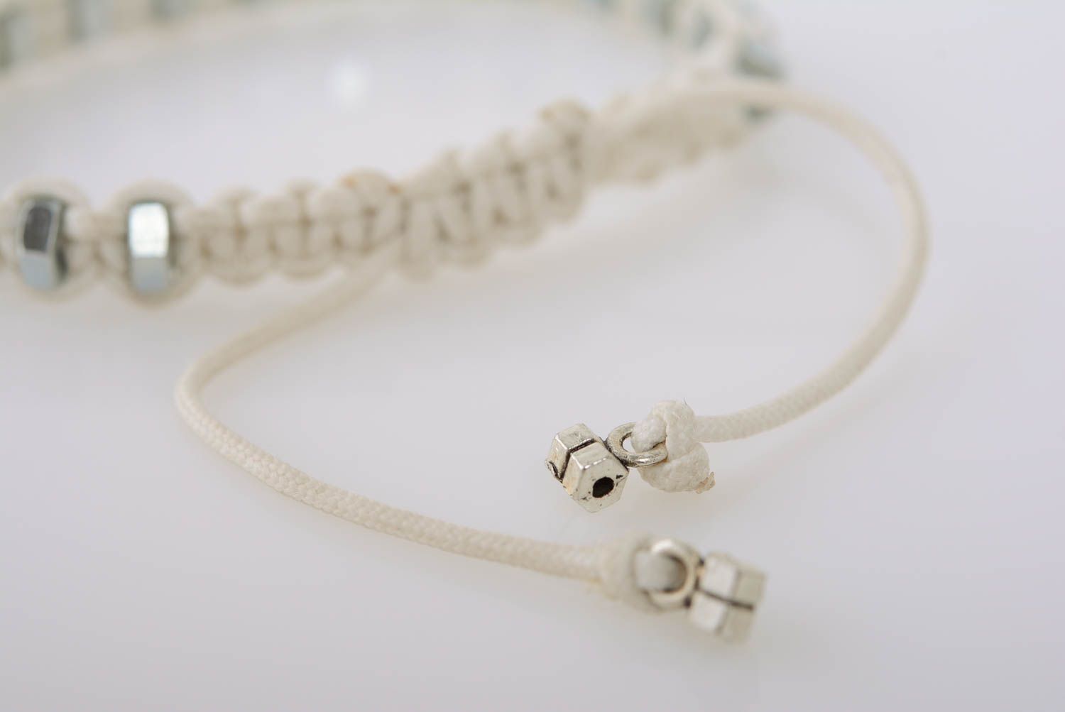 White women's handmade designer macrame woven cord bracelet with steel nuts photo 5