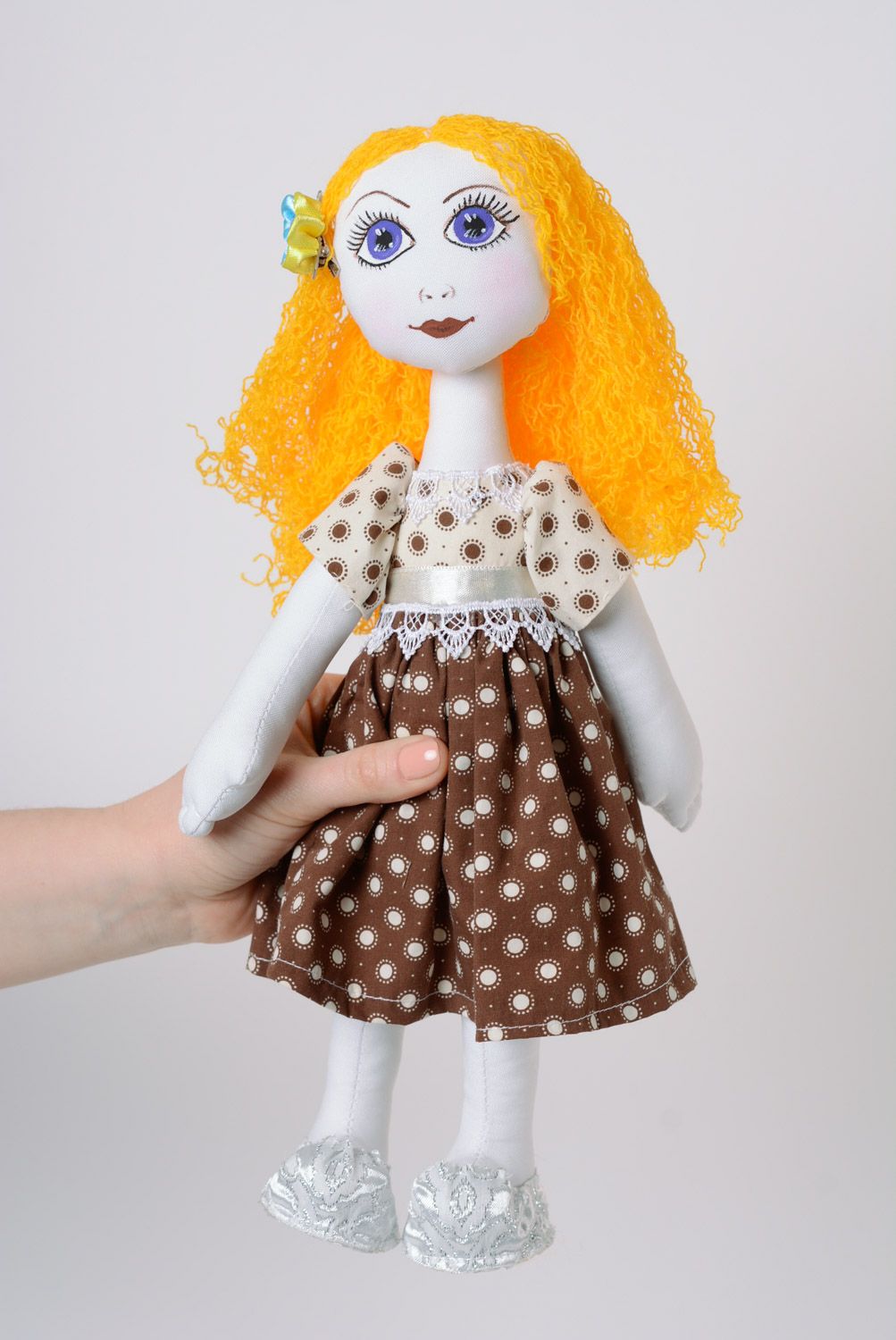 Handmade fabric soft doll of average size with yellow hair in dress photo 1