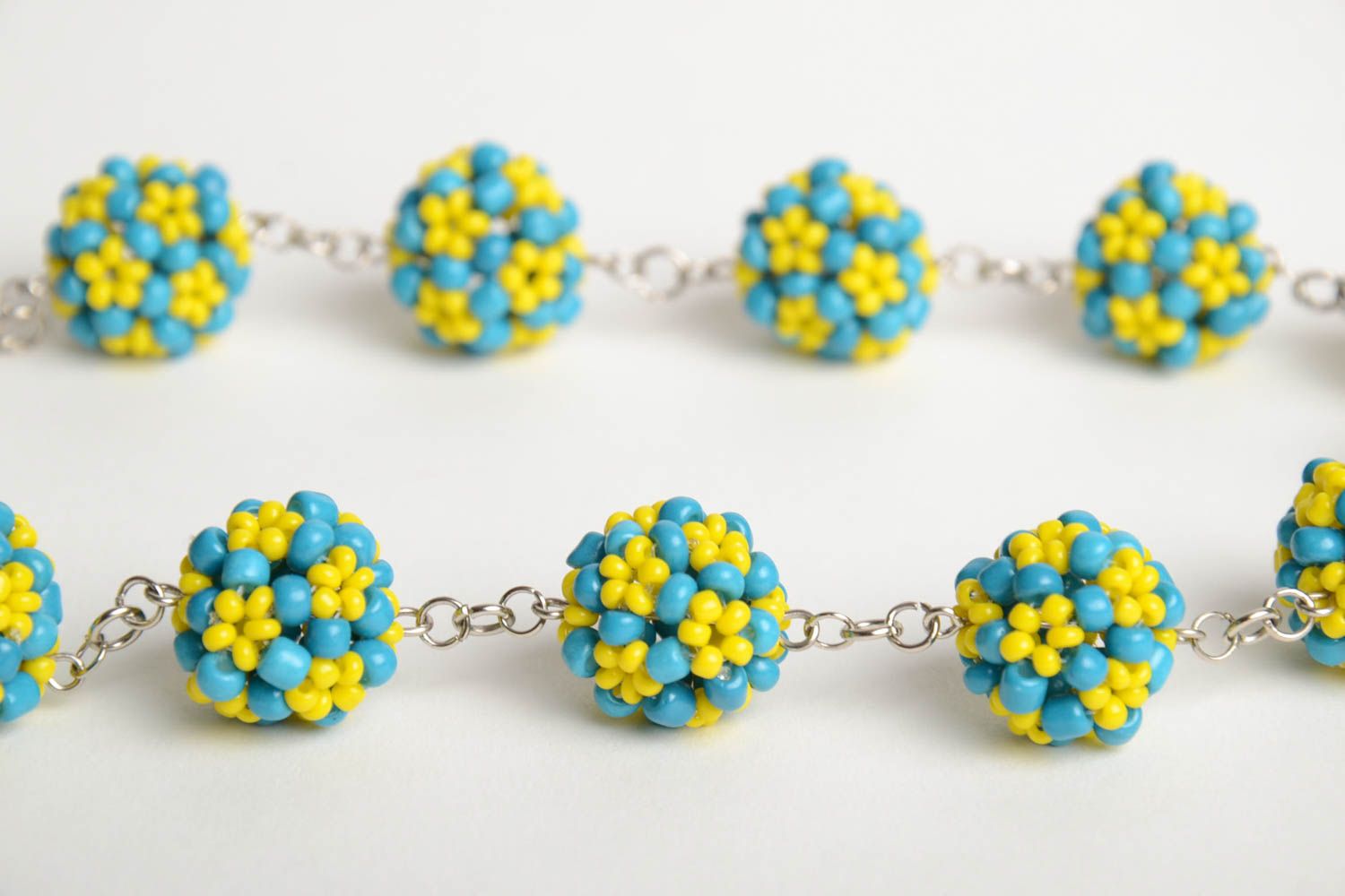 Handmade designer necklace with metal chain and bead woven blue and yellow balls photo 4