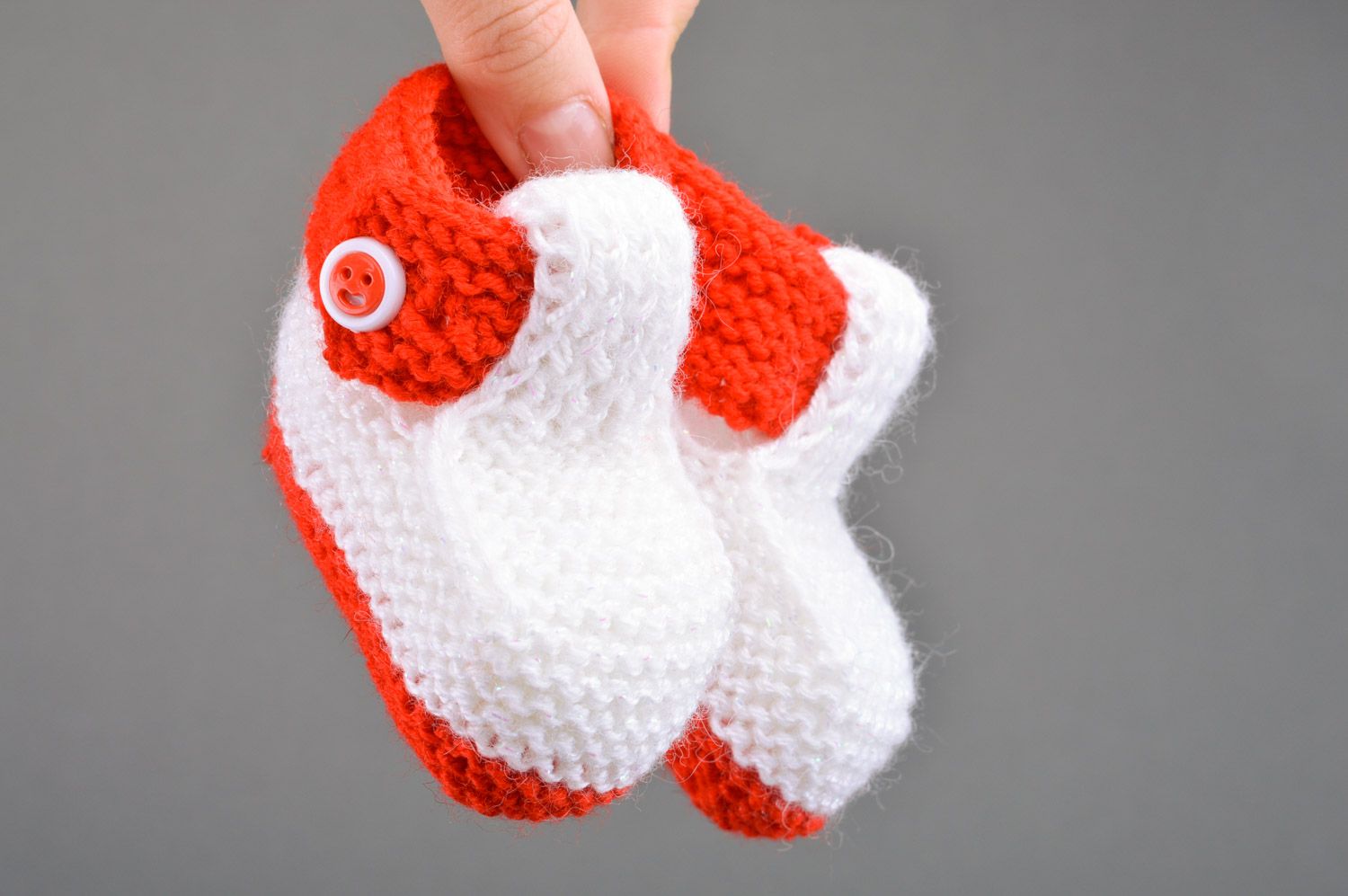 Red and white handmade knitted half-woolen baby booties with buttons photo 3
