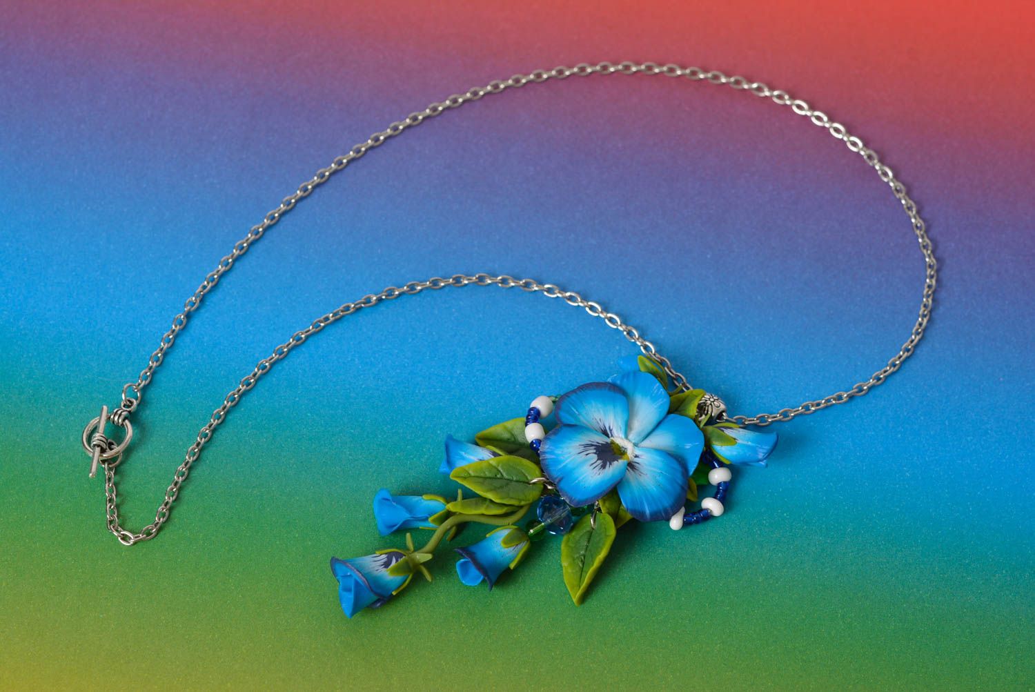 Handmade designer blue floral polymer clay pendant on metal chain photo 1