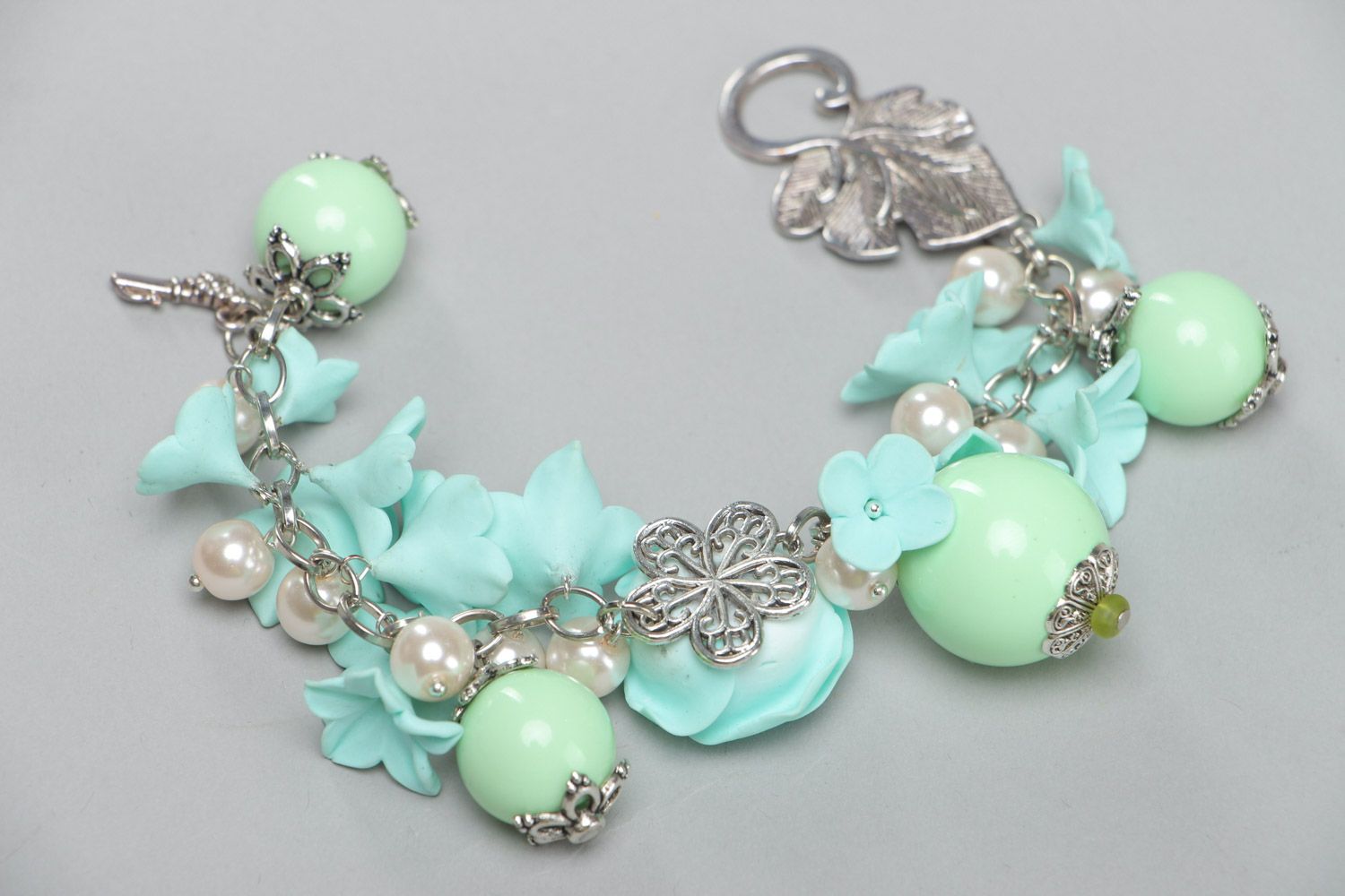 Handmade beautiful designer flower bracelet with charms made of polymer clay in mint color photo 5
