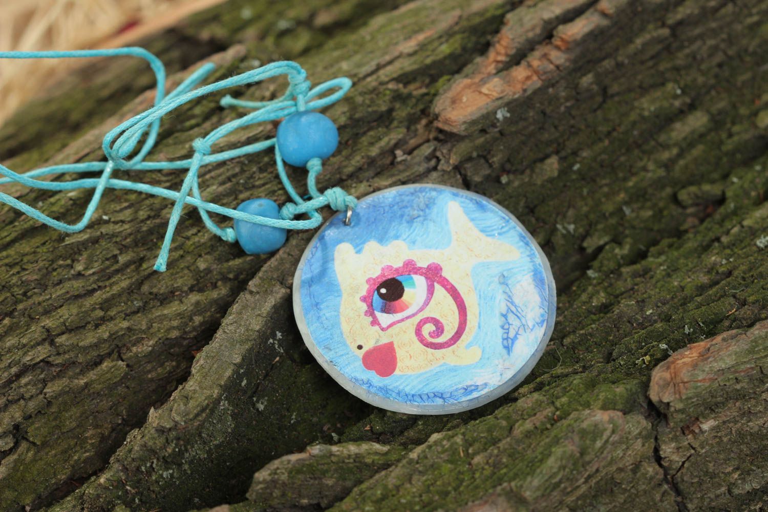 Handmade round shape pendant with blue fish print made of polymer clay photo 1