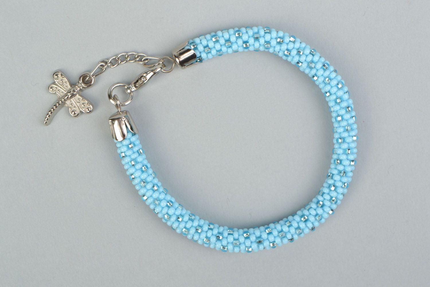 Tender handmade blue and silver beaded cord bracelet with dragonfly charm photo 2