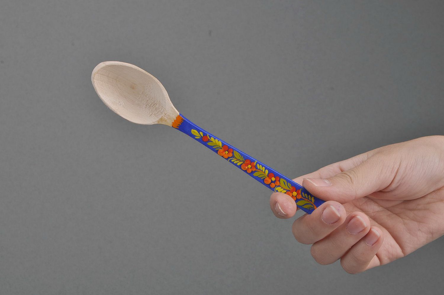 Wooden teaspoon with blue handle photo 2