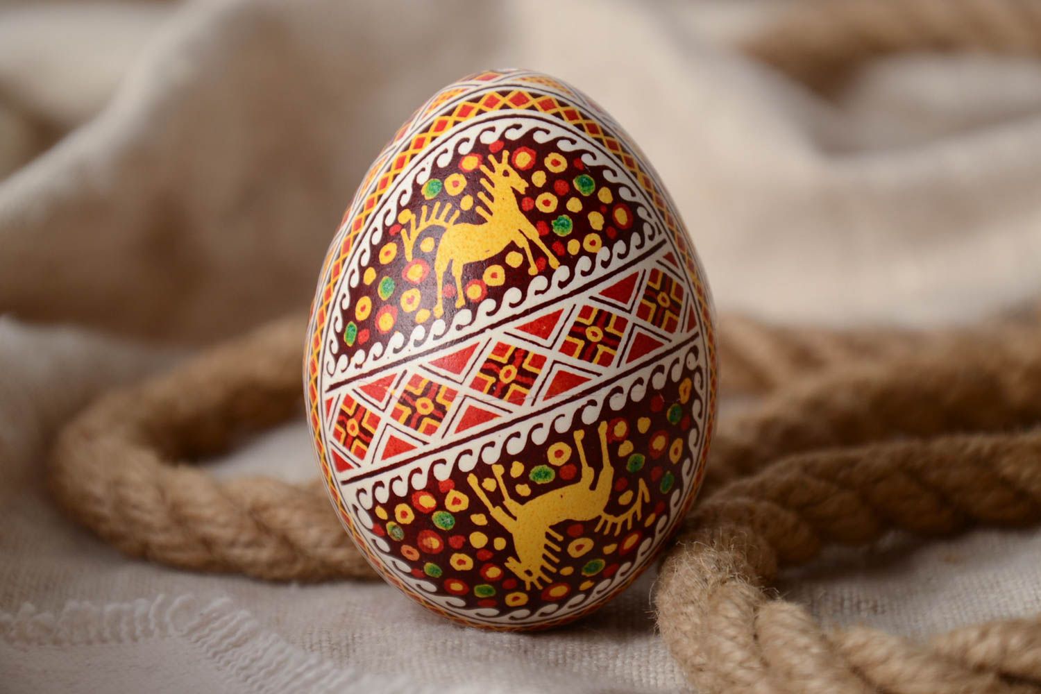 Handmade Easter egg painted with aniline dyes using waxing technique photo 1