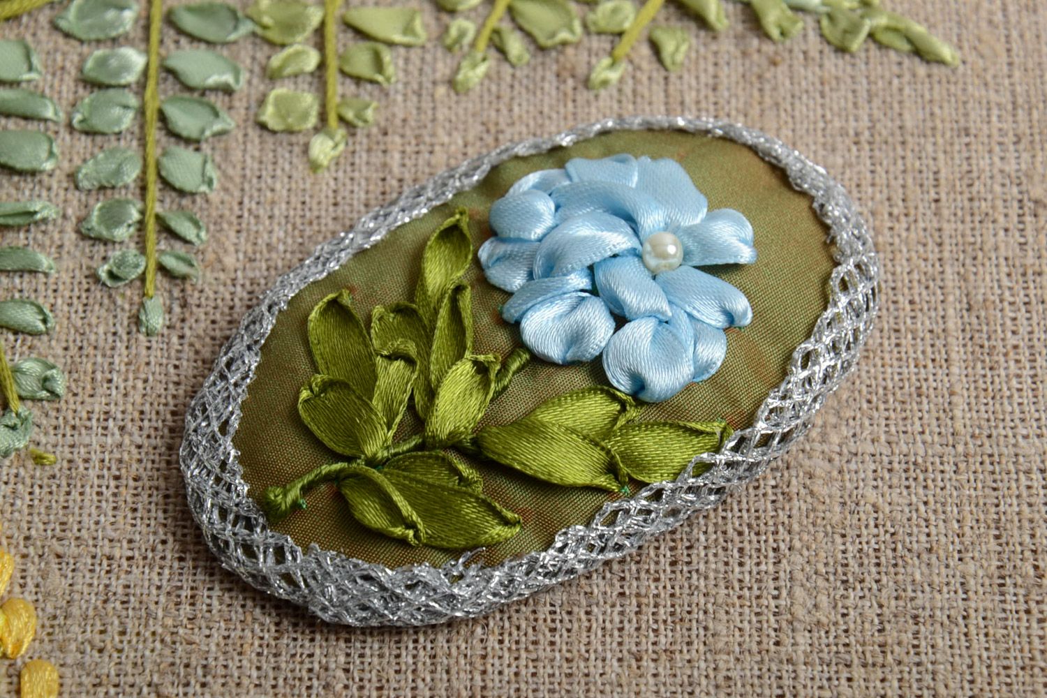 Handmade textile brooch with blue flowers embroidery using satin ribbons photo 1