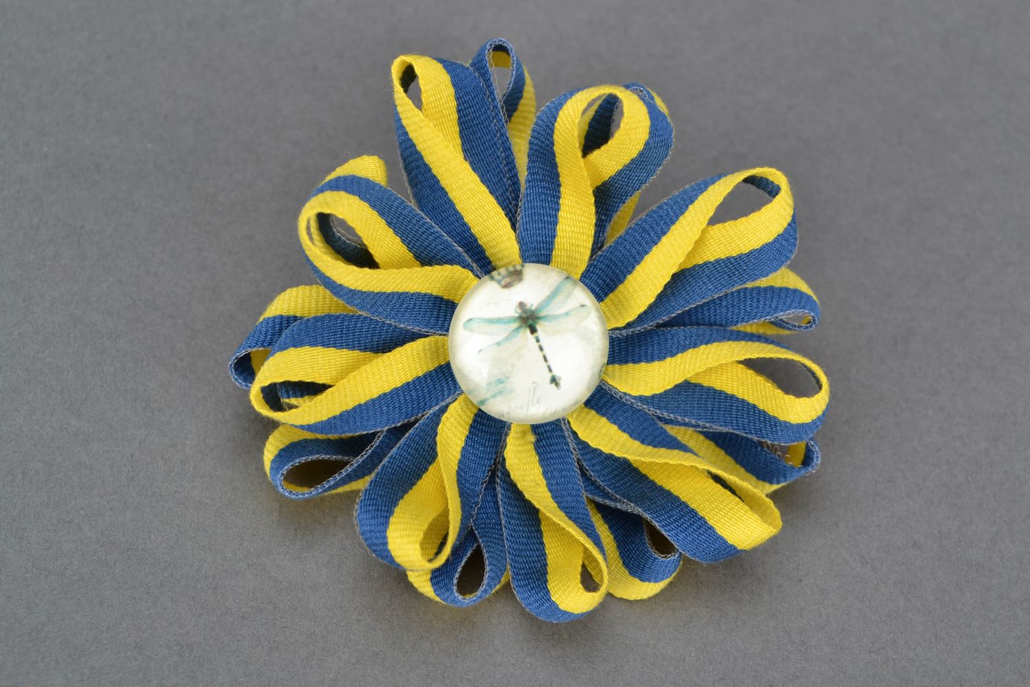 Textile brooch with rep ribbons photo 1