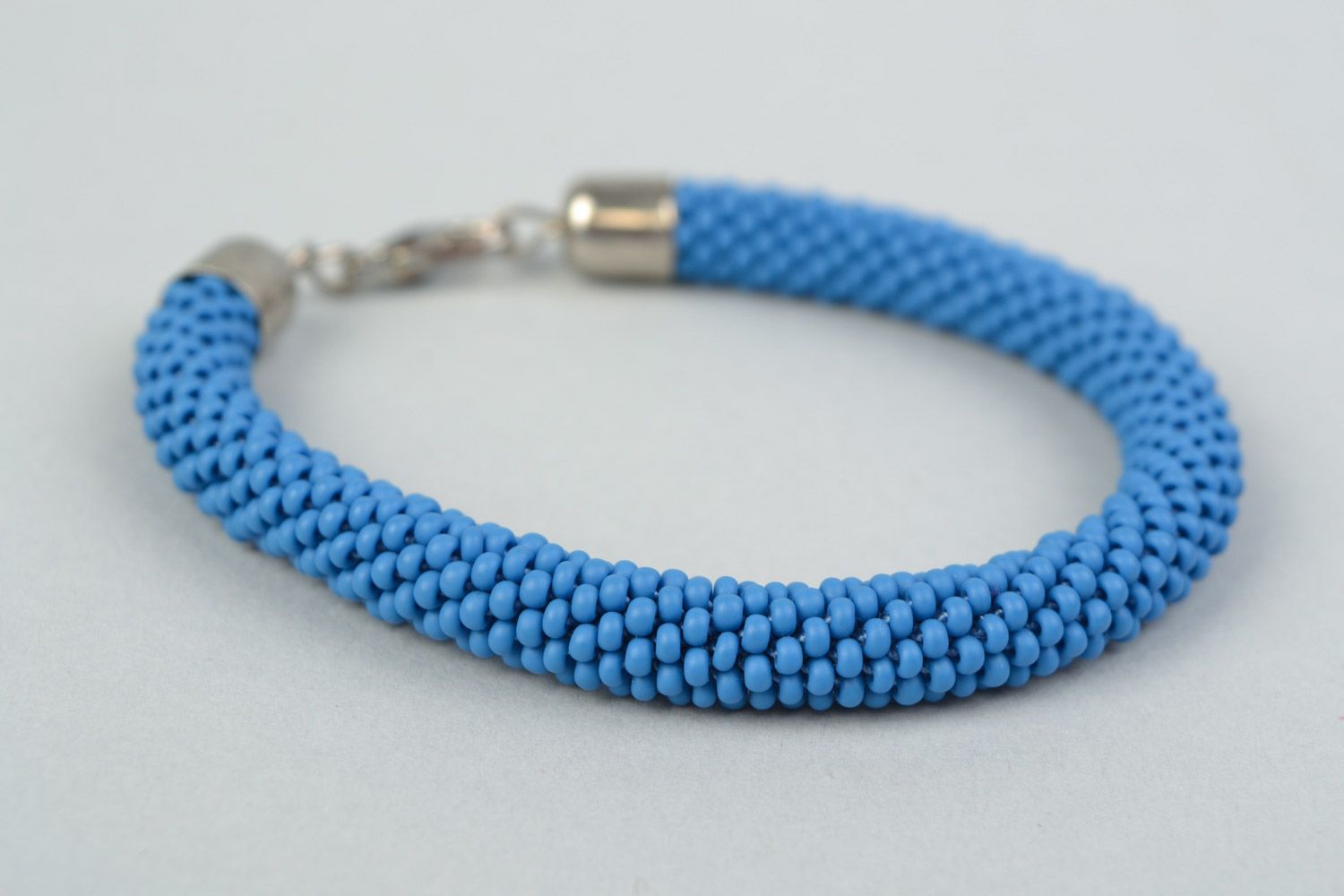 Handmade bright laconic beaded cord wrist bracelet of sky blue color for girl photo 3