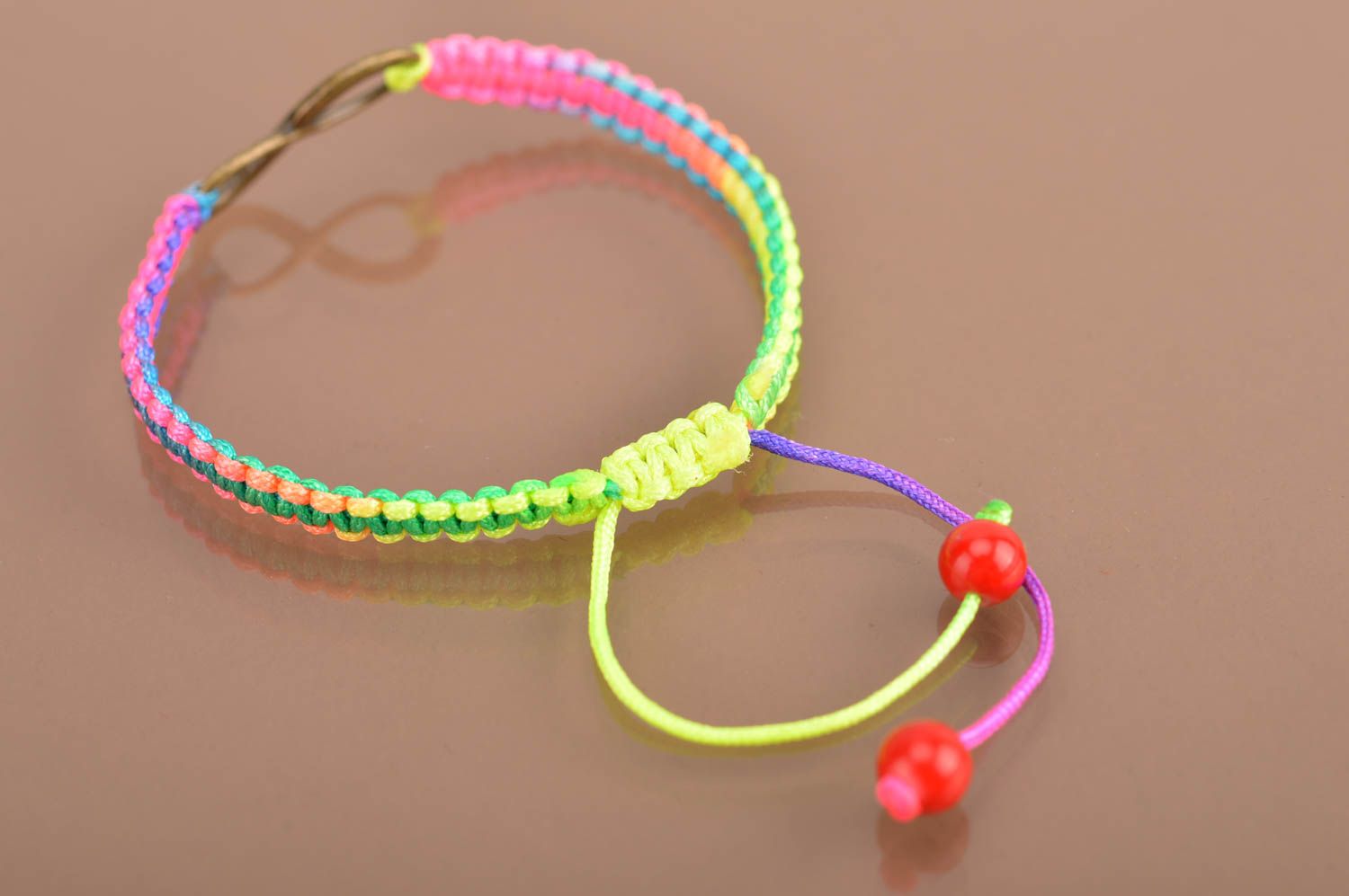 Handmade cute thin colorful woven wrist bracelet made of silk with insert photo 5