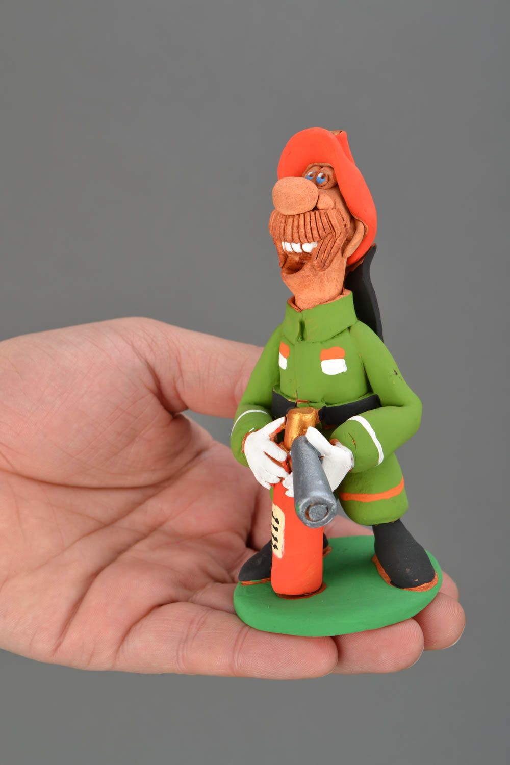 Ceramic figurine Firefighter with Fire Extinguisher photo 2