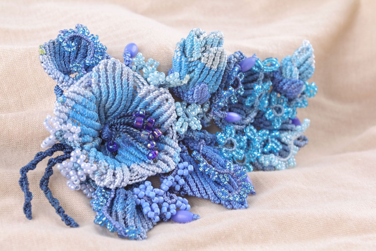 Blue brooch made of threads and beads photo 1