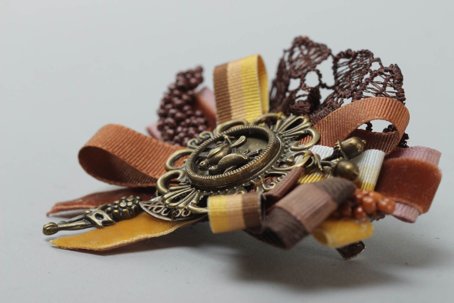 Handmade rep ribbon brooch with lace and charms in brown color palette photo 3