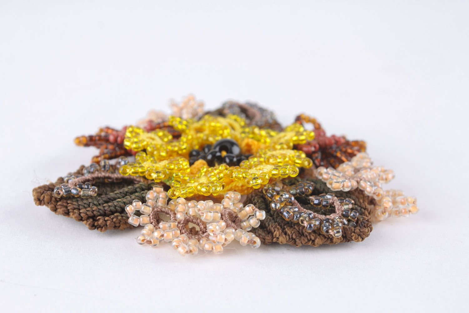 Beaded brooch made of threads photo 3
