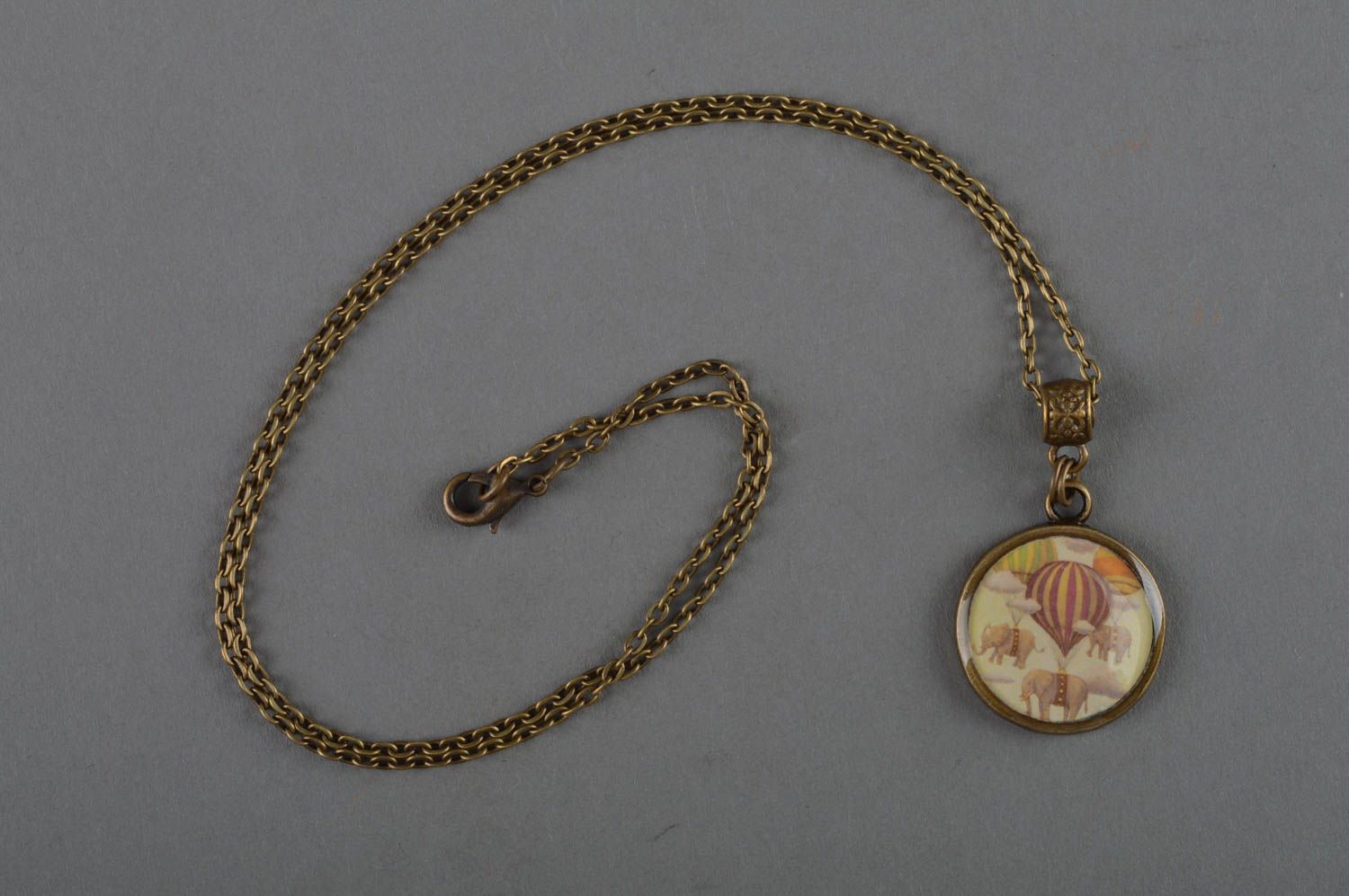 Beautiful handmade decoupage pendant coated with epoxy and equipped with bronze-like chain photo 1