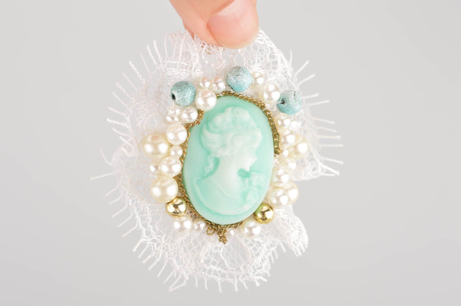 Handmade mint-colored cameo brooch with white lace accessory for women photo 3