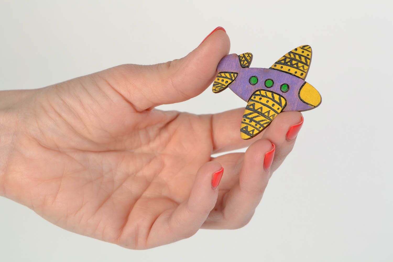 Handmade wooden brooch painted with acrylics in the shape of colorful air plane photo 2