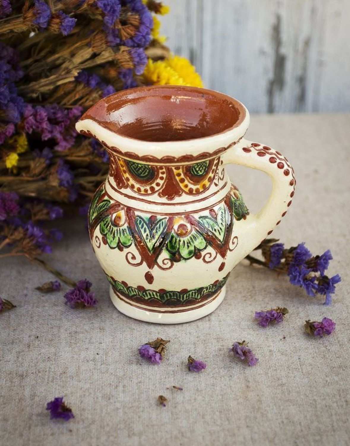 Decorative clay pitcher photo 1