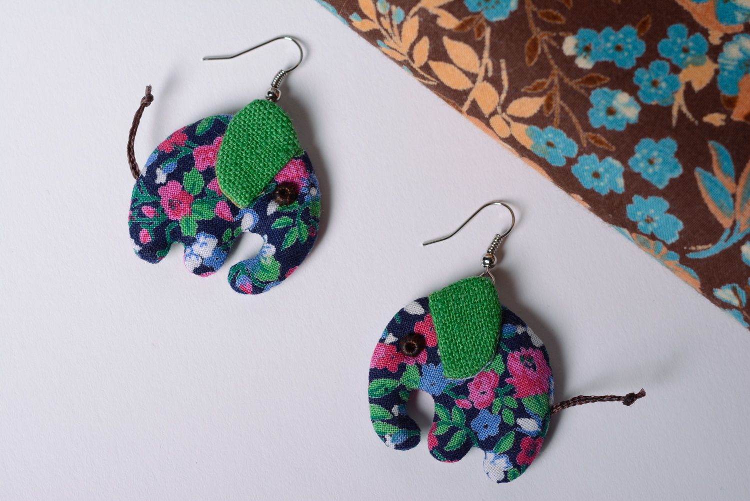 Beautiful earrings hand made of linen and cotton fabric in the shape of elephants photo 1