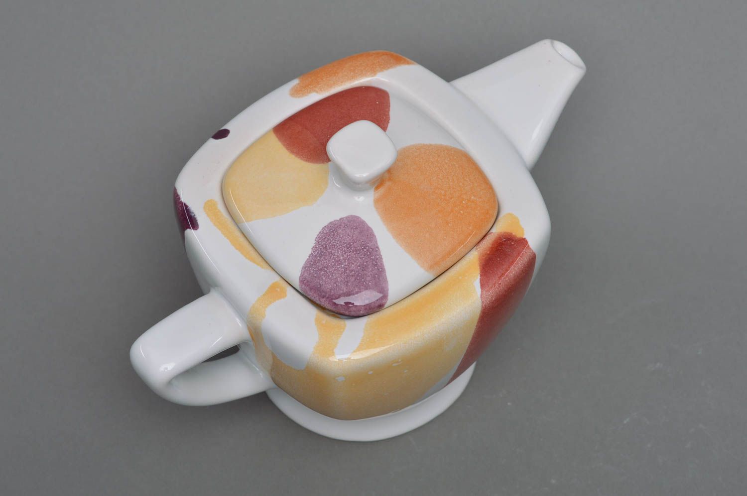 Square porcelain white tea kettle in red, yellow, and white color  photo 2