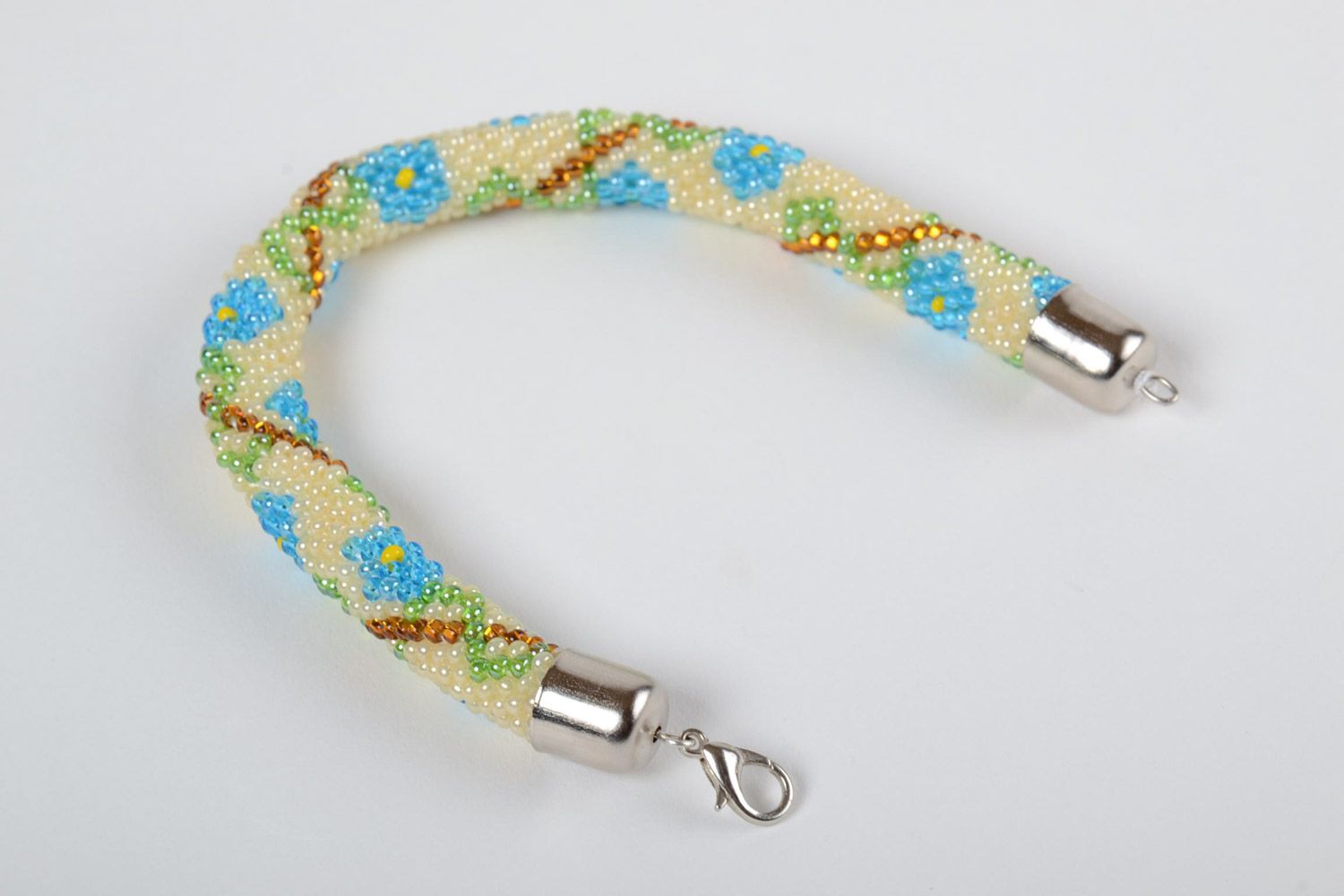 Bright beaded cord adjustable bracelet in ethnic style with floral ornament photo 4