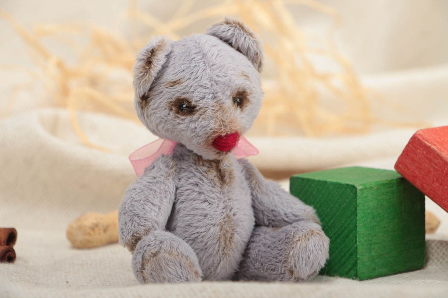 Handmade small faux fur soft toy bear of gray color with pink bow for children photo 1