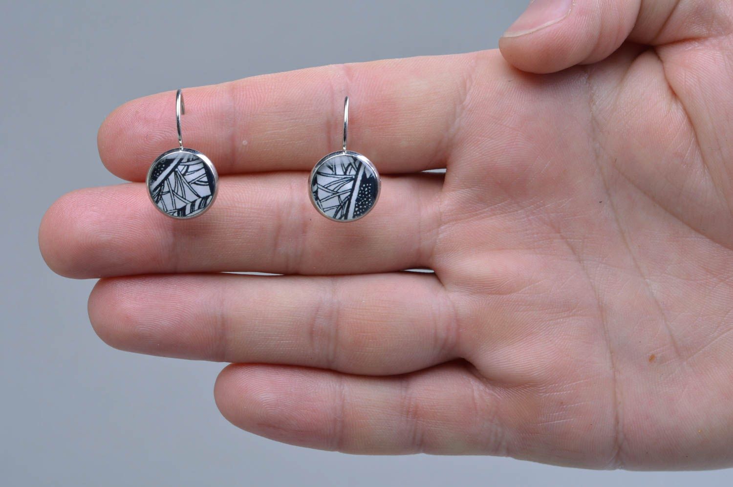 Handmade round decoupage silver colored dangling earrings with epoxy resin photo 4