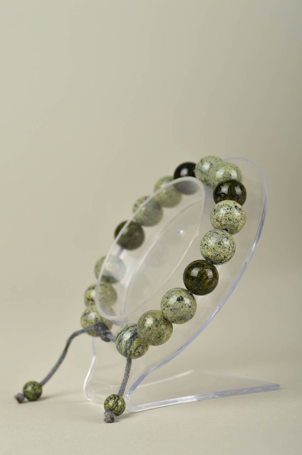 Strand pale green and black beaded bracelet on gray wax cord photo 5
