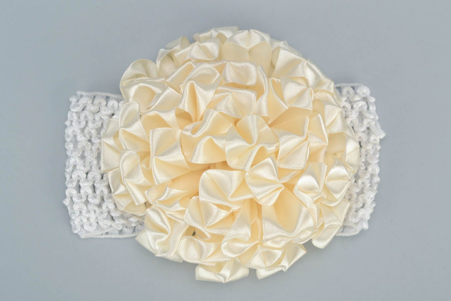 Handmade decorative elastic headband of milky color with flower for baby girl photo 3