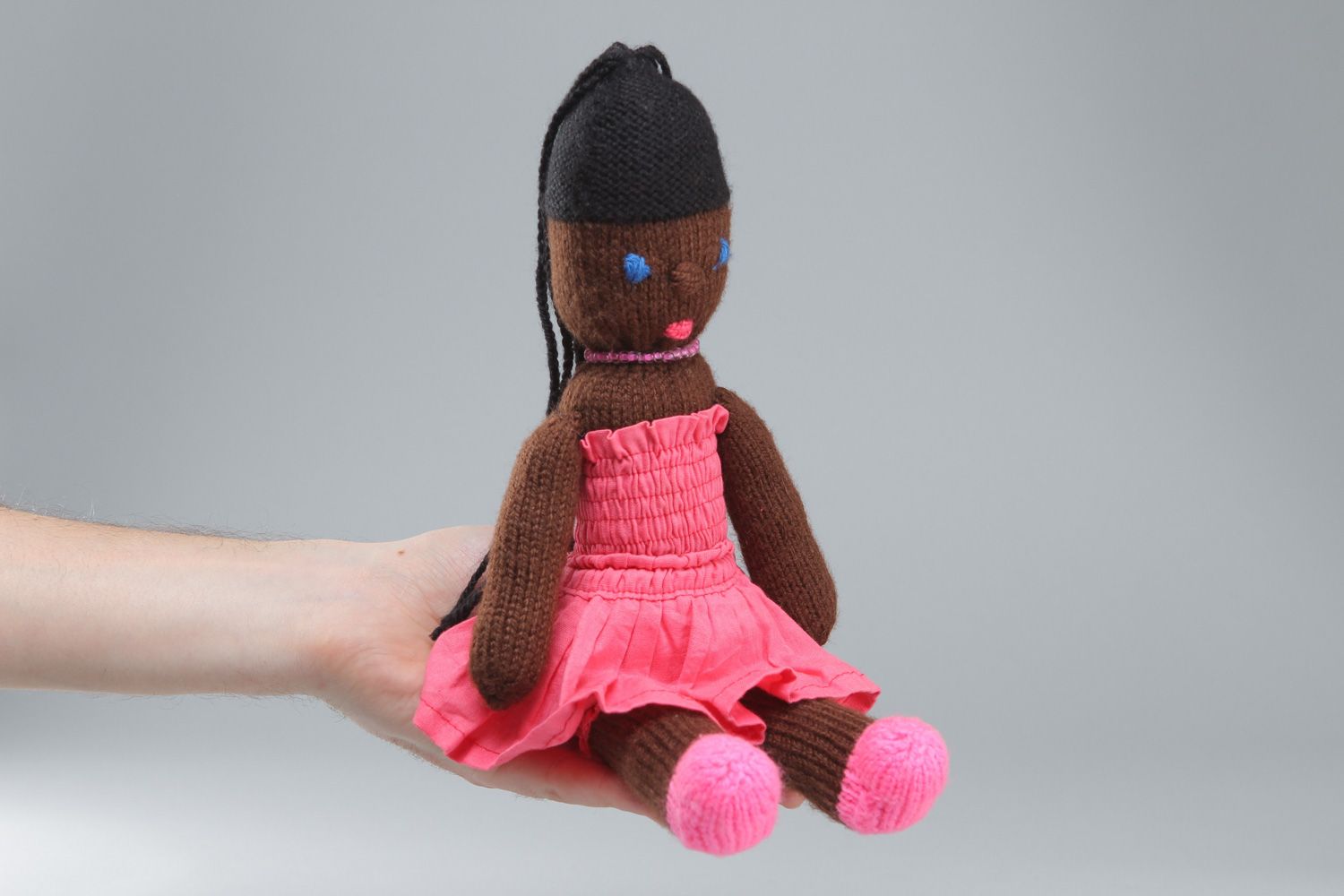 Handmade soft toy knitted of acrylic threads Mulatto in pink dress for little girl photo 4