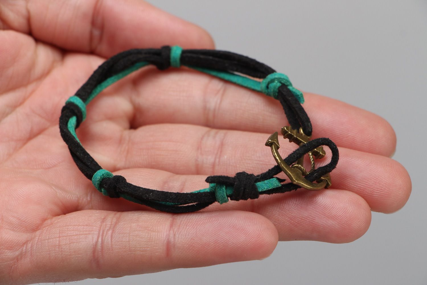 Handmade friendship wrist bracelet woven of faux suede with anchor shaped charm photo 3