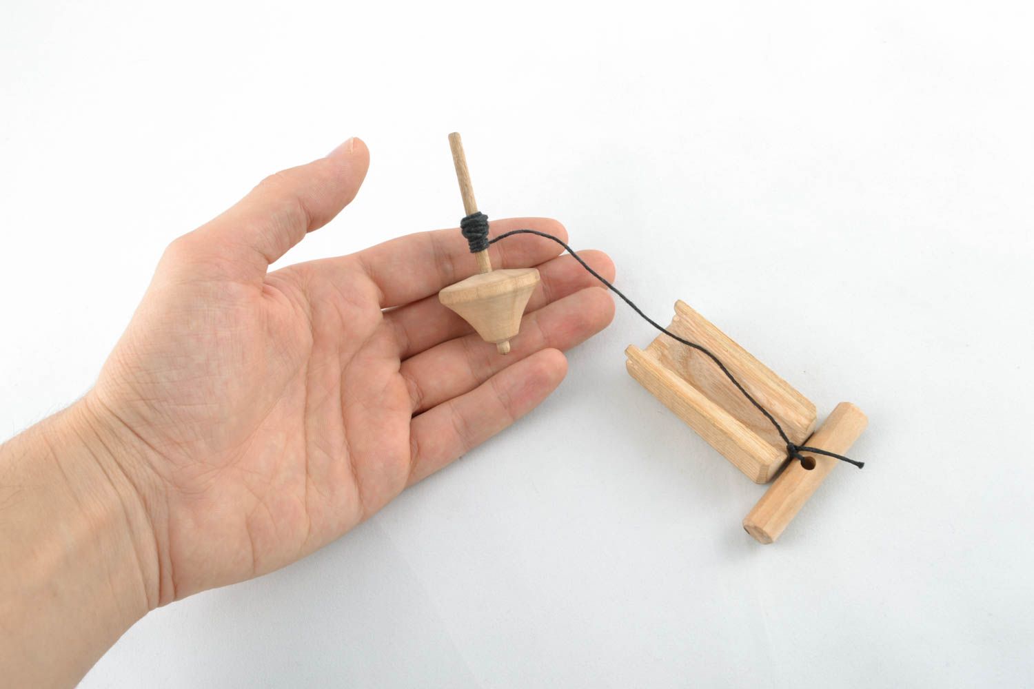 Wooden spin top for children photo 4