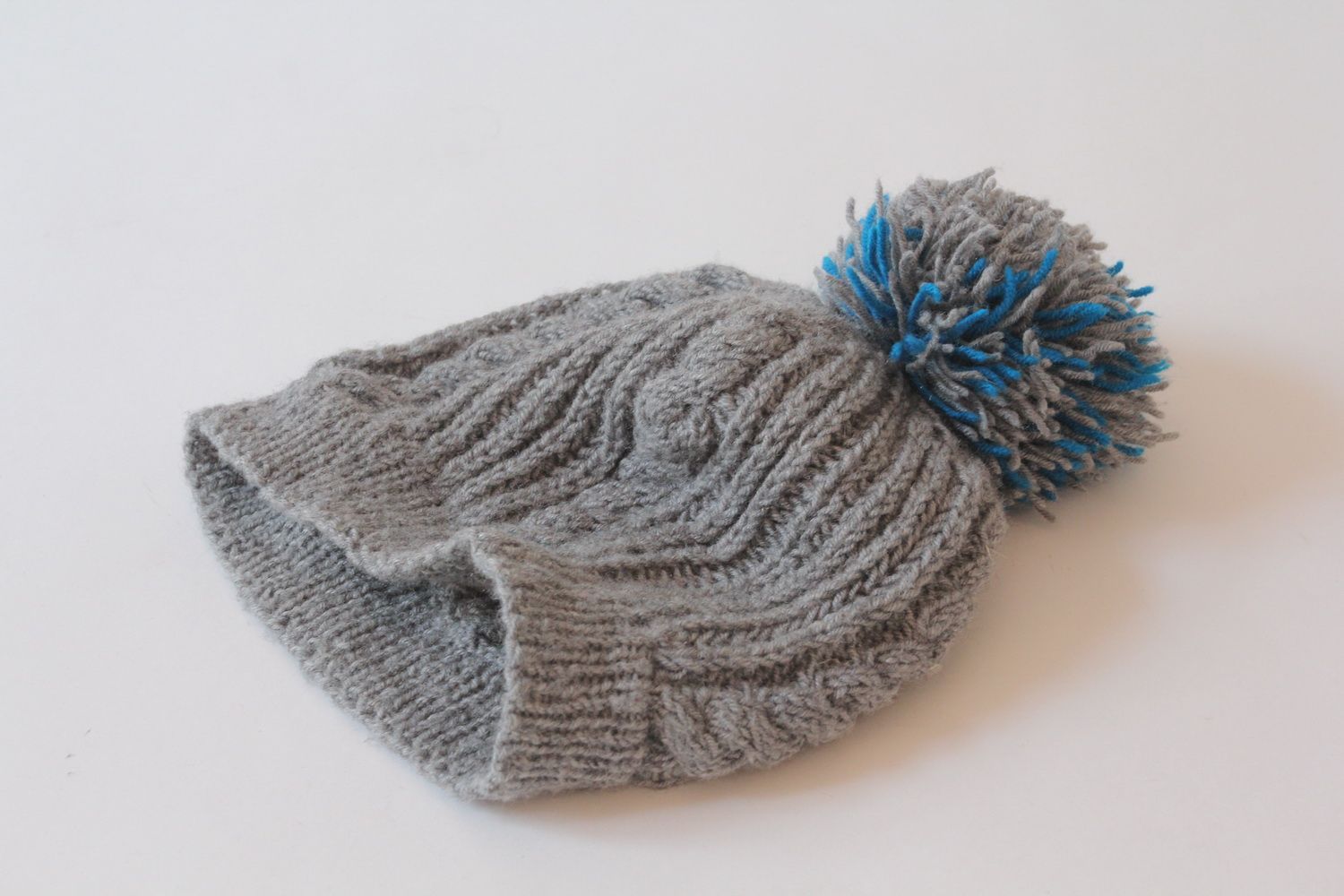 Knitted hat with pompom photo 2
