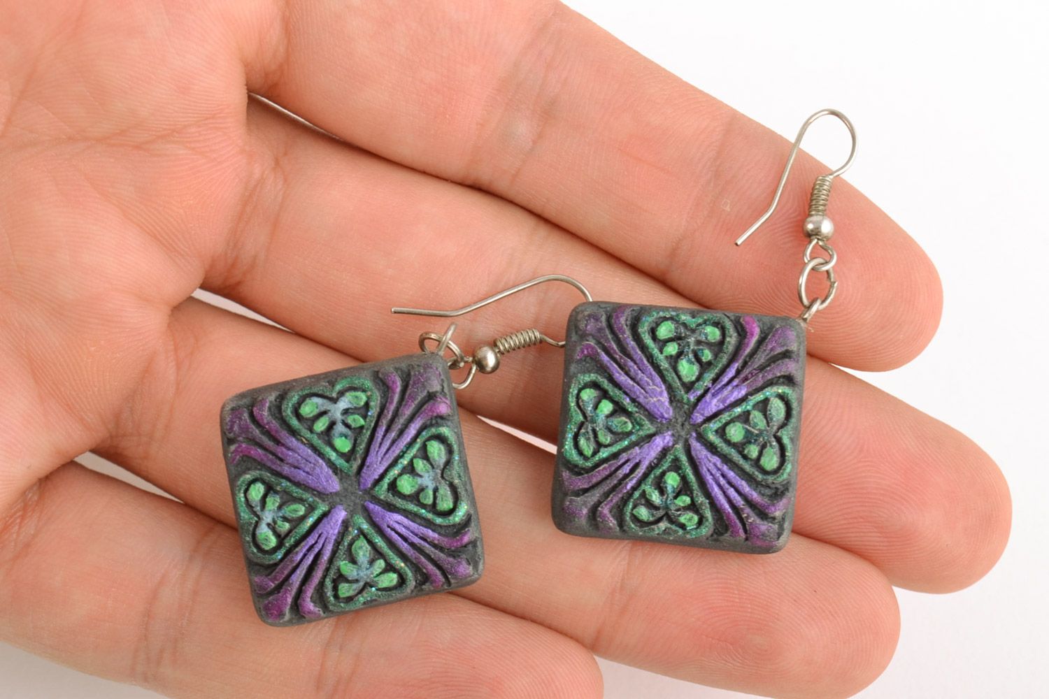 Handmade ceramic rhombus-shaped dangling earrings of black color with ornament photo 2