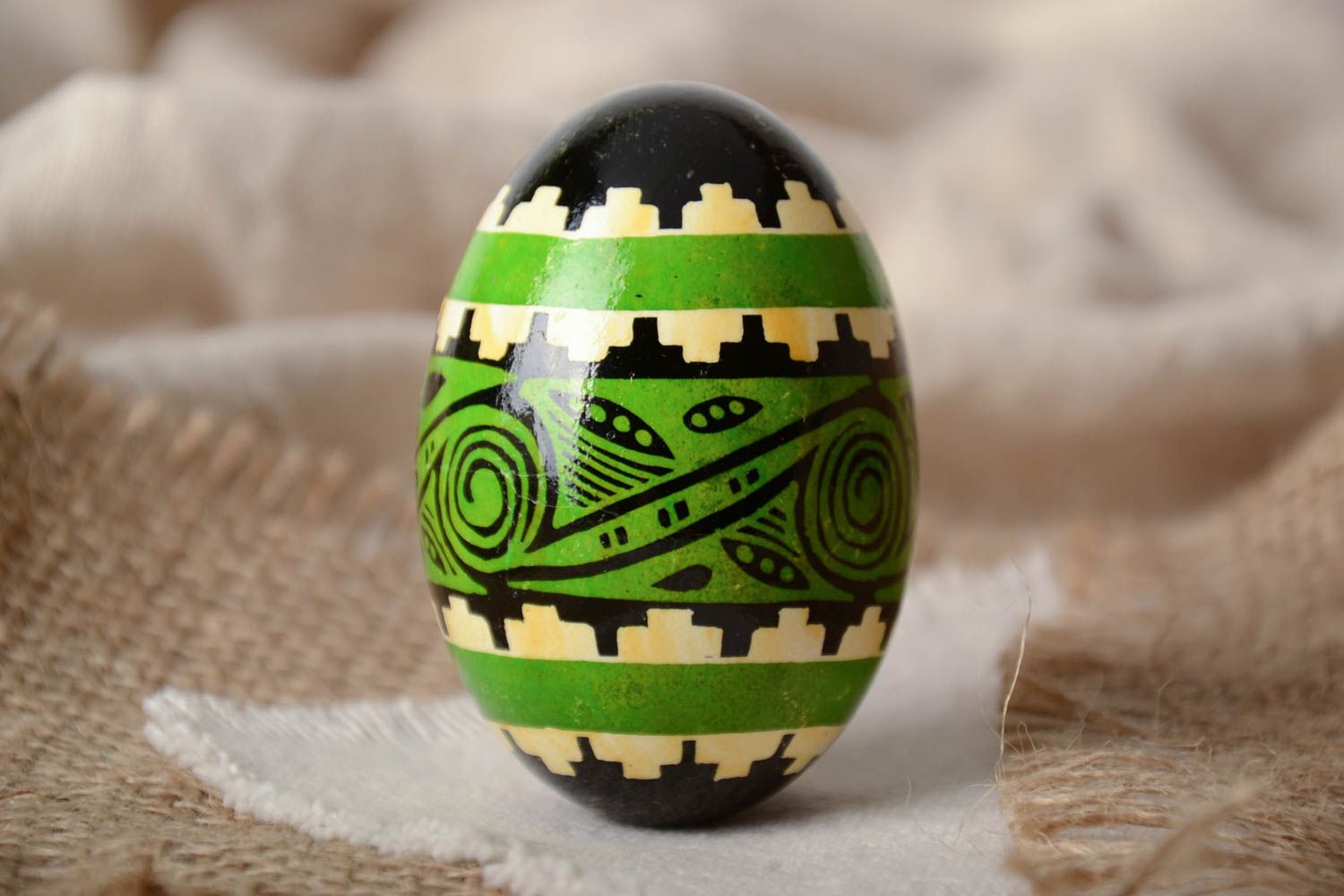Green and black handmade painted goose egg ornamented using waxing technique photo 1