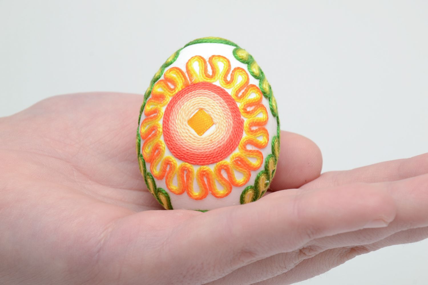 Bright decorative Easter egg decorated with threads photo 5